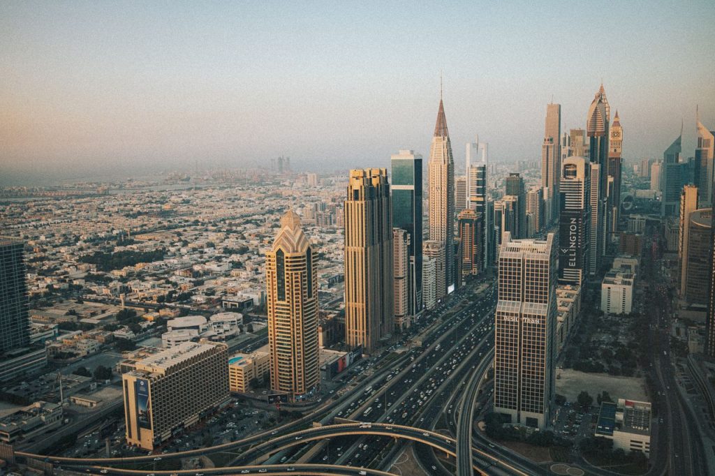 Stunning aerial shot of Dubai's modern skyline with iconic skyscrapers at dusk.